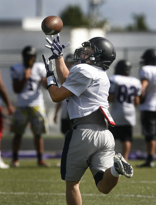 Scott Sommerdorf   |  The Salt Lake Tribune
Lehi running back Caden Calton pulls in a pass during practice, Wednesday, September 18, 2013. Calton has run for almost 1,000 yards in just four games.