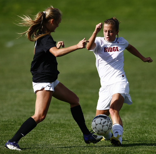 Chris Detrick  |  The Salt Lake Tribune
Davis' Mia Stoddard (4) Northridge's Tawnie Fitzgerald (7) go for the ball during the game at Northridge High School Tuesday September 17, 2013.