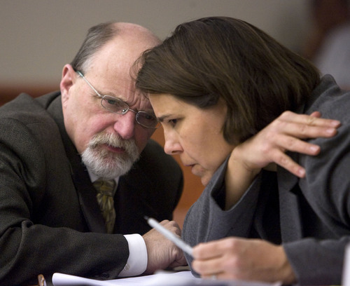 Al Hartmann   |  The Salt Lake Tribune 
Defense lawyer Ron Yengich, left,  confers with prosecuter Patricia Cassell in Judge Ann Boyden's courtroom in Third District Court Friday April 15 during a preliminary hearing for Ricky Angilau. He is charged with murder for shooting classmate Esteban Saidi near Kearns High School January 21, 2009.  Angilau is charged with first-degree felony murder as well as obstructing justice, unlawfully carrying a concealed weapon and carrying a gun in a school. He faces up to life in prison if convicted of the crimes.