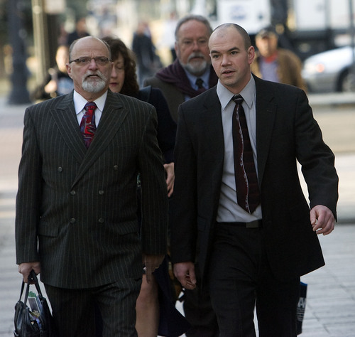 Al Hartmann   |  The Salt Lake Tribune 
Tim DeChristopher, right, enters Frank Moss Federal Courthouse in Salt Lake City on Thursday, March 3, with his lawyer Ron Yengich.