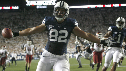 Chris Detrick  |  The Salt Lake Tribune
Brigham Young Cougars tight end Kaneakua Friel (82) celebrates after scoring a touchdown during the first half of the game against Washington State at LaVell Edwards Stadium in Provo on Thursday, Aug. 30, 2012.