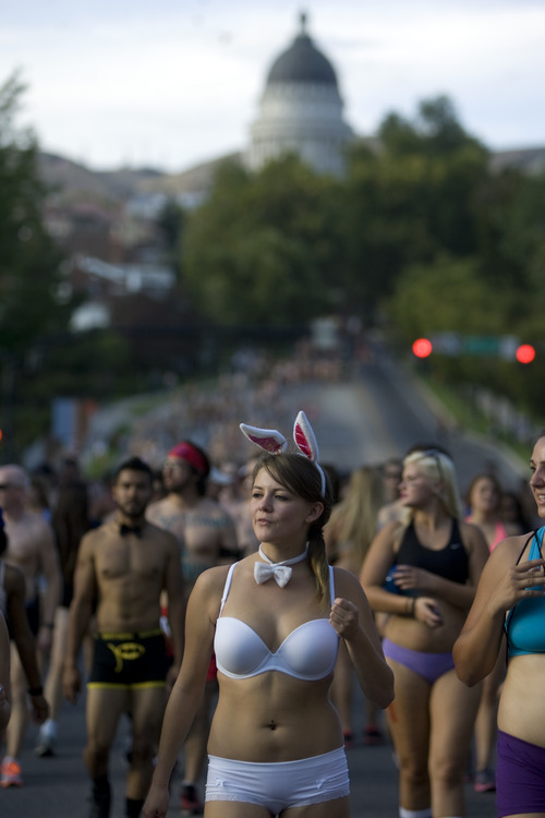 Kim Raff | The Salt Lake Tribune
Karlie Shupe runs down State Street during the 5k Utah Undie Run in Salt Lake City, Utah on September 9, 2012. Thousands of people gathered in hopes of breaking last years record of 2,270 people which was the largest gathering of people wearing only underpants.