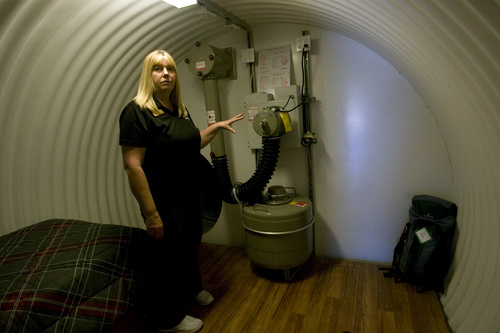 Rick Egan  | The Salt Lake Tribune 

Dawn Kaufman shows the air-exchange unit in the Atlas survival shelter, Thursday, Sept. 19, 2013. The shelter at Emergency Essentials is open for public tours in Bountiful.