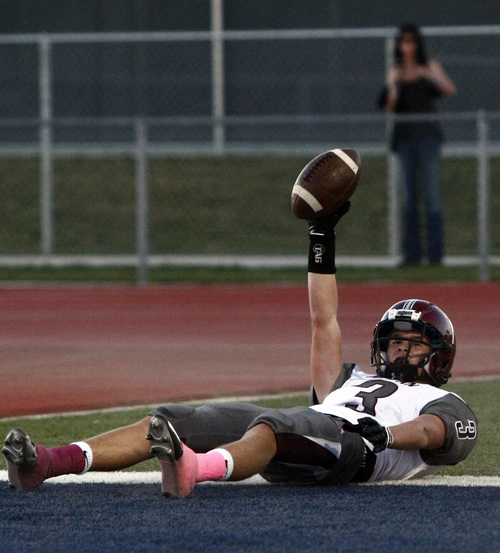 Chris Detrick  |  The Salt Lake Tribune
Jordan's Cooper Clark (3) makes a touchdown catch past Herriman's Conner Johnson (3) during the game at Herriman High School Friday September 20, 2013.