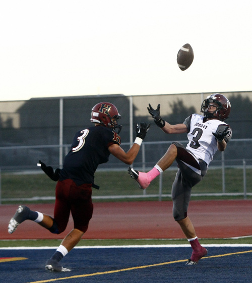 Chris Detrick  |  The Salt Lake Tribune
Jordan's Cooper Clark (3) makes a touchdown catch past Herriman's Conner Johnson (3) during the game at Herriman High School Friday September 20, 2013.