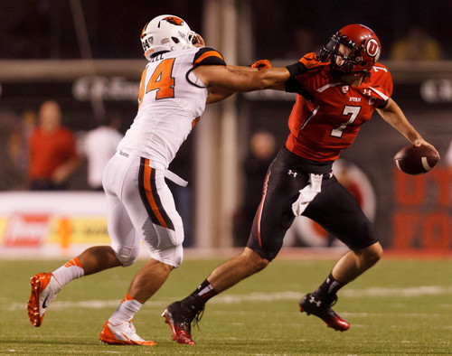 Trent Nelson  |  The Salt Lake Tribune
Oregon State Beavers defensive end Devon Kell (94) chases down Utah Utes quarterback Travis Wilson (7) as the University of Utah hosts Oregon State, college football at Rice Eccles Stadium Saturday, September 14, 2013 in Salt Lake City. Kell was called for a facemask penalty on the play.
