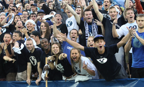 Rick Egan  | The Salt Lake Tribune 

BYU students refuse to give up their seats in the students section, even after the announcement was made to seek cover from the rain and lightening, as a rainstorm hit Lavell Edwards stadium, an hour before game time, as BYU prepared to face the University of Texas, Saturday, September 7, 2013.