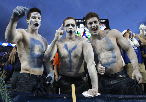 Rick Egan  | The Salt Lake Tribune 

Mathew Astel, Spencer Tolson, and Ammon Collins, cheer for the cougars,  as BYU faced The University of Utah game, at Lavell Edwards Stadium, Saturday, September 21, 2013.