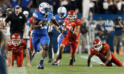 Trent Nelson  |  The Salt Lake Tribune
Brigham Young Cougars running back Adam Hine (28) runs for what would have been a touchdown, but was called back on a holding penalty in the first quarter as the BYU Cougars host the Utah Utes, college football Saturday, September 21, 2013 at LaVell Edwards Stadium in Provo.