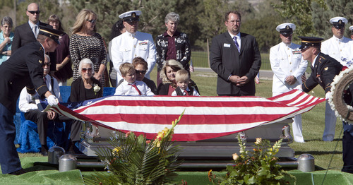 Steve Griffin  |  The Salt Lake Tribune

Kristen Carlson and her sons Jonathan, 6, and Ethan, 3, and family and friends watch as the American Flag, covering the casket of their husband and father, Iraq war veteran James Steven Carlson, is folded graveside at the Utah Veteran's Memorial Park in Bluffdale, Utah Friday, Sept. 20, 2013.