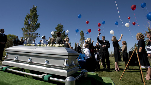 Steve Griffin  |  The Salt Lake Tribune

Balloons are released during graveside services fro Iraq war veteran James Steven Carlson, at the Utah Veteran's Memorial Park in Bluffdale, Utah Friday, Sept. 20, 2013.