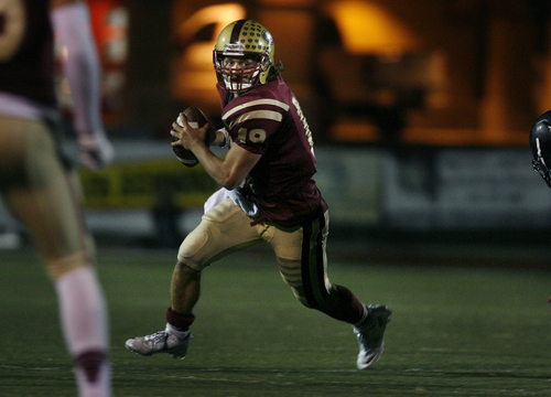 Scott Sommerdorf   |  The Salt Lake Tribune
Logan QB Chase Nelson runs for some of his state record 691 yards of total offense as Logan beat Roy 49-38 in Logan, Friday, September 19, 2013.