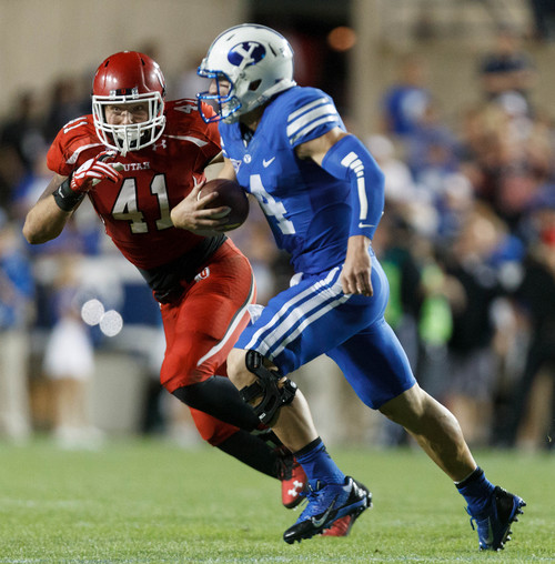 Trent Nelson  |  The Salt Lake Tribune
Utah Utes linebacker Jared Norris (41) chases down Brigham Young Cougars quarterback Taysom Hill (4) in the third quarter as the BYU Cougars host the Utah Utes, college football Saturday, September 21, 2013 at LaVell Edwards Stadium in Provo.