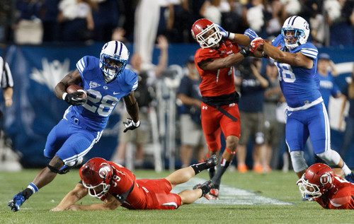 Trent Nelson  |  The Salt Lake Tribune
Brigham Young Cougars running back Adam Hine (28) runs for what would have been a touchdown, but was called back on a holding penalty in the first quarter as the BYU Cougars host the Utah Utes, college football Saturday, September 21, 2013 at LaVell Edwards Stadium in Provo.