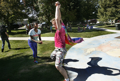 Scott Sommerdorf   |  The Salt Lake Tribune
Sergey Khrushchev dances with Whitney Martin at Provo's first Pride Festival, held at Memorial Park in Provo on Saturday.