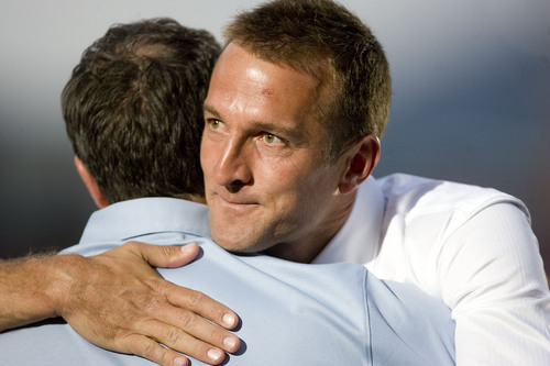 Jeremy Harmon  |  The Salt Lake Tribune

RSL coach Jason Kreis gets a hug from his childhood coach Gary Williamson during a ceremony was Kreis's number was retired Monday, July 4, 2011.