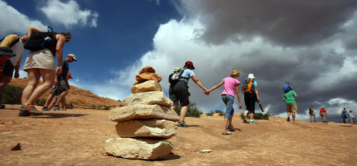 Francisco Kjolseth  |  The Salt Lake Tribune
A long line of visitors stretches out along the sandstone as people make the three-mile round trip to one of Utah's most famous icons, the famed Delicate Arch in Arches National Park in late May.
