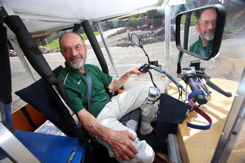 Francisco Kjolseth  |  The Salt Lake Tribune
Andy Schoenberg, a retired bioengineering professor from the University of Utah and a former NASA engineer, sits behind the wheel of his Ecotrike 14. The solar vehicle has undergone many upgrades since the first one he created and now he's trying to bring them to market. His Ecotrikes harness the power of the sun through a solar panel that makes up the roof of the small vehicle.