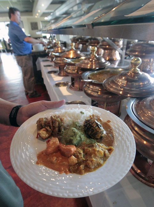 Al Hartmann  |  The Salt Lake Tribune
Lunchtime customers at the Copper Bowl in Salt Lake City serve themselves from the Indian food buffet served in hot copper bowls.  The entrees change daily.