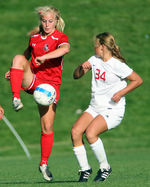 Steve Griffin  |  The Salt Lake Tribune

Bountiful's Liz Creeze stops the ball in front of East's Paige Barta during match at East High School in Salt Lake City, Utah Tuesday, September 24, 2013.