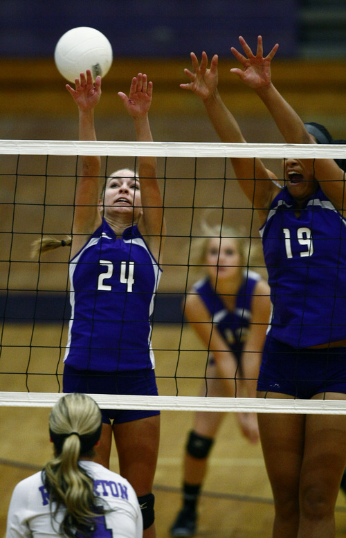 Chris Detrick  |  The Salt Lake Tribune
Lehi's Ashley Robbins (24) and Lehi's Faitoto'a Faleao (19) go up for a block during the game at Riverton High School Thursday September 26, 2013.