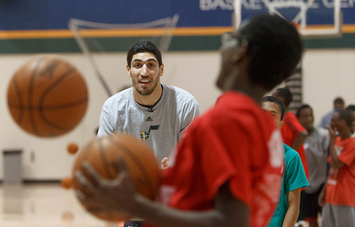 Trent Nelson  |  The Salt Lake Tribune
Utah Jazz center Enes Kanter gets into the drill at a basketball clinic for youth affiliated with the State Refugee Services Office and Because He Loved us First ministry, in Salt Lake City, Thursday, September 26, 2013.