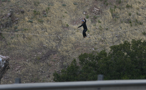 Scott Sommerdorf   |  The Salt Lake Tribune
Cameron Kolk walks a high line at "Suicide Rock" near the mouth of Parley's Canyon, Thursday, September 26, 2013.