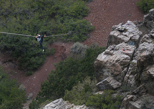 Scott Sommerdorf   |  The Salt Lake Tribune
One of two young men slips, but does not fall as he walks a slack line at "Suicide Rock" near the mouth of Parley's Canyon, Thursday, September 26, 2013. He successfully made it to the other side.