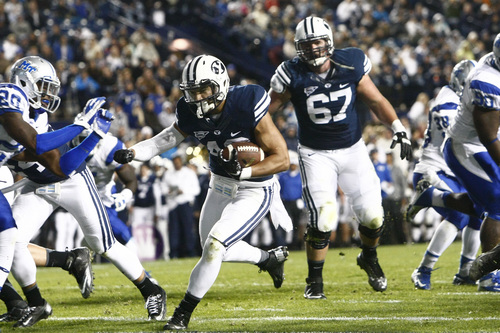 Chris Detrick  |  The Salt Lake Tribune
Brigham Young Cougars running back Michael Alisa (42) runs past Middle Tennessee Blue Raiders safety Kevin Byard (20) for a touchdown during the first half of the game at LaVell Edwards Stadium Friday September 27, 2013. BYU is winning the game 23-10 at halftime.