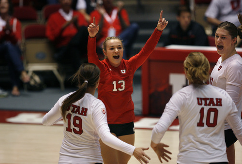 Scott Sommerdorf   |  The Salt Lake Tribune
Utah's Lea Adolph (#13) celebrates a point with teammates during the first set 25-22 loss to USC as Utah is matched against USC in volleyball, Sunday, September 29, 2013