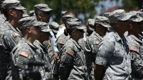 Francisco Kjolseth  |  Tribune file photo
Utah National Guard personnel gather in June at a groundbreaking for a new chapel at Camp Williams. Guard and other military leaders in Utah were gearing up Monday for a possible government shutdown.