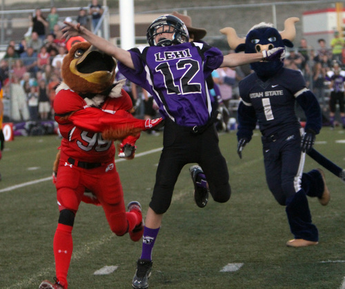 Rick Egan  | The Salt Lake Tribune 

Sweep plays defense for the mascots, during the Mascot bowl at Lehi High, Monday, September 30, 2013.