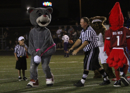 Rick Egan  | The Salt Lake Tribune 

Clutch from the Houston Rockets, uses the referees's hat to cover-up, after losing his jersey in the game, during the Mascot's bowl at Lehi High, Monday, September 30, 2013.