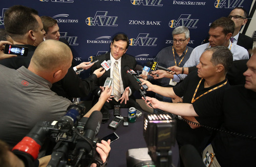 Francisco Kjolseth  |  The Salt Lake Tribune
General manager of the Utah Jazz Dennis Lindsey is surrounded by the media as he attends Media Day at the Zions Bank Basketball Center in Salt Lake on Monday, Sept. 30, 2013.