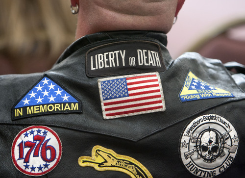 Steve Griffin  |  The Salt Lake Tribune

Members of the Patriot Guard listen to speakers inside the chapel during the Utah volunteers of the Missing In America Project's Military Funeral Service for 11 unclaimed Utah veterans (and one spouse) whose remains have been in the care of two area mortuaries at the Utah Veterans Cemetery and Memorial Park in Bluffdale, Utah Thursday, October 3, 2013.