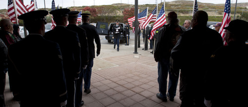Steve Griffin  |  The Salt Lake Tribune

Members of the Utah Army National Guard Honor Guard carry unclaimed remains, from a hearse, during the Utah volunteers of the Missing In America Project's Military Funeral Service for 11 unclaimed Utah veterans (and one spouse) whose remains have been in the care of two area mortuaries at the Utah Veterans Cemetery and Memorial Park in Bluffdale, Utah Thursday, October 3, 2013.