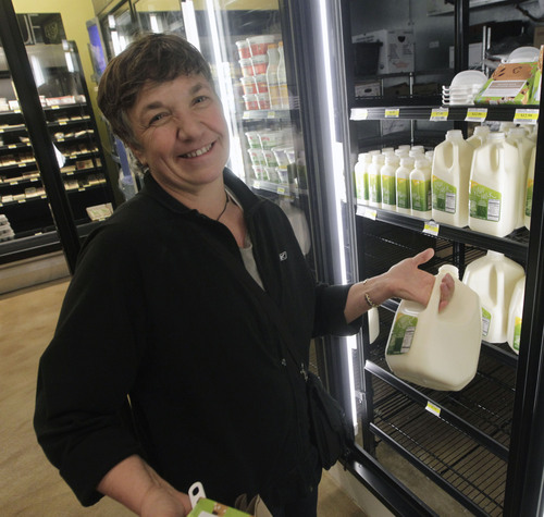 Al Hartmann  |  The Salt Lake Tribune
April Brown, who grew up in Salt Lake City but spent time in New Zeland, buys a gallon of raw unpasteurized milk from Real Foods Market in Sugar House. She bought it regularly in glass bottles in New Zeland.  She said that she planned to make yogurt. Real Foods Market is the first retail outlet in Salt Lake County to sell raw (unpasteurized) milk.