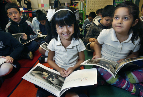 Scott Sommerdorf   |  The Salt Lake Tribune
First-graders Daniela Perez, center, and Evelyn Cardenas, right, seem pleased on Thursday after they were given free copies of "Otis" by author Loren Long. Mayor Ralph Becker had just finished reading the book to Kristal Munk's 1st grade class at Mountain View Elementary as part of Jumpstart's "Read for the Record" program presented in partnership with the Pearson Foundation.