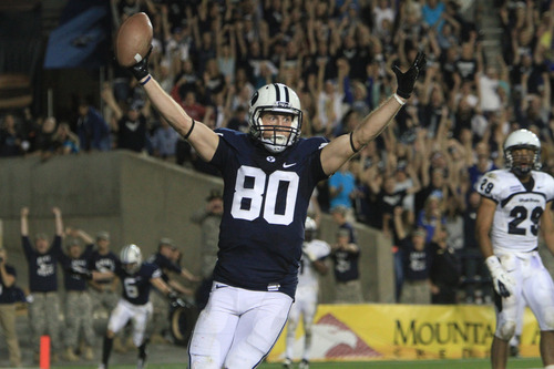 Rick Egan  | The Salt Lake Tribune 

Brigham Young Cougars tight end Marcus Mathews (80) celebrates the winning touchdown as BYU  defeated Utah State, 27-24, on this touchdown pass with 11 seconds left in the game,  in Provo, Friday, Sept. 30, 2011.