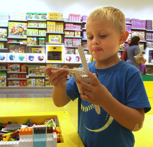Rick Egan  | The Salt Lake Tribune 
 
Dylan Harrison plays with LEGOs at the new LEGO store at the Fashion Place Mall, Wednesday, Oct. 2, 2013.