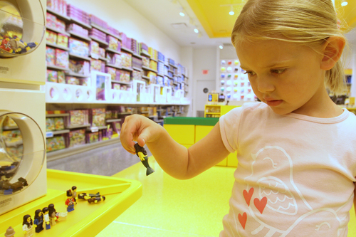 Rick Egan  | The Salt Lake Tribune 

Five-year-old Kate Callister plays with LEGOs at the new LEGO store at the Fashion Place Mall, Wednesday, Oct. 2, 2013.