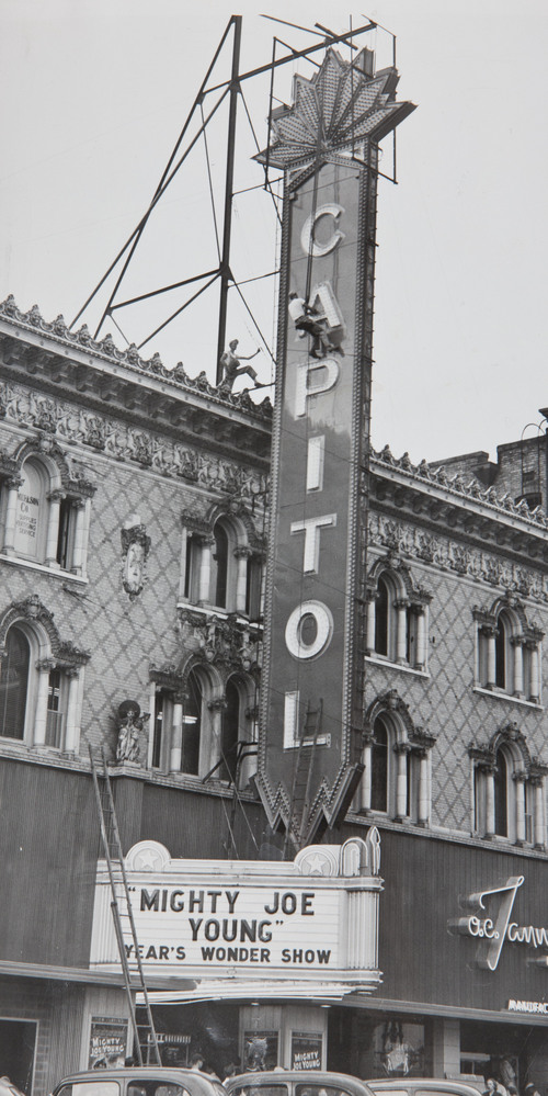 Tribune File Photo
Workers suspended from the sign in front of the Capitol Theatre in this photo dated 1949.