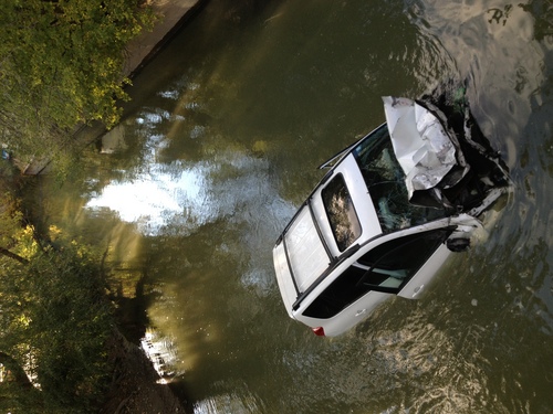 Chris Detrick | The Salt Lake Tribune
A car plunged into a canal in Murray on Friday afternoon, leaving two people in serious condition.