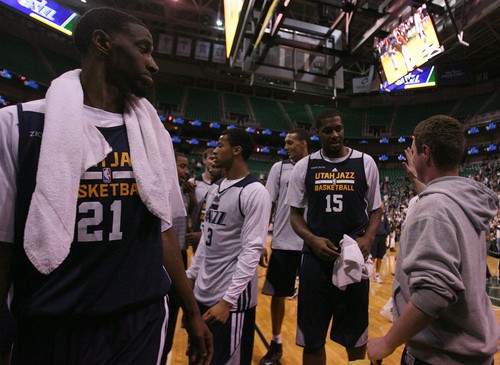 Leah Hogsten | The Salt Lake Tribune
Utah Jazz Derrick Favors gets a high five from a fan while leaving the court.  Utah Jazz fans filled  EnergySolutions Arena to get a glimpse at this year's players during the annual scrimmage Saturday, October 5, 2013. The Jazz roster currently includes 20 players, but NBA rules require that that number must be reduced to 15 by opening night, Oct. 30 against Oklahoma City.