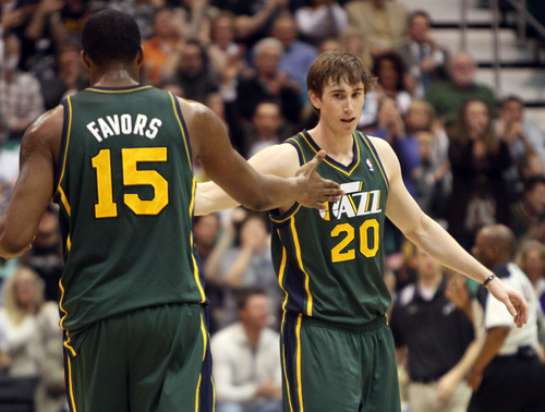 Rick Egan  | The Salt Lake Tribune 

Utah Jazz power forward Derrick Favors (15) and Utah Jazz shooting guard Gordon Hayward (20) after Hayward hit a 3-pointer, giving the Jazz 87-76 lead with 2:56 left in the game, in NBA action, The Utah Jazz vs. The Memphis Grizzlies at EnergySolutions Arena, Saturday, March 16, 2013.