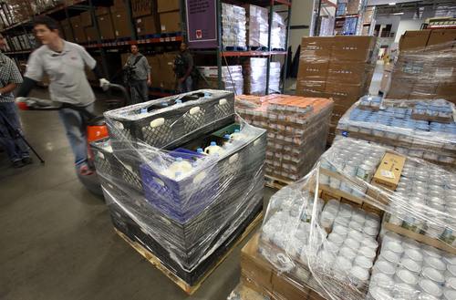 Francisco Kjolseth  |  The Salt Lake Tribune
Lillian Dick of the Utah Food Bank unloads a delivery of much needed food and baby formula that have become critical staples in light of the recent problems in Washington. The day the federal government shut down and it was announced that Women, Infants, and Children (WIC) clinics across the nation would no longer be able to operate, the Salt Lake County Council approved the expenditure of emergency funds so Salt Lake County WIC recipients could still receive food and baby formula. The council agreed to spend $62,500 on food and another $75,000 to pay staff members who run a half dozen WIC clinics in the county. The U.S. Department of Agriculture later released $2.5 million to the state to help keep clinics across Utah open through the end of October.
