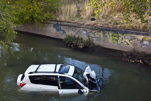 Chris Detrick  |  The Salt Lake Tribune
A car plunged into a canal in Murray, leaving two people in serious condition on Friday. A four-car accident sent at least one vehicle into a canal in Murray on Friday afternoon and left several people in serious condition. The accident happened about 4:30 p.m. near 4200 S. State Street, according to Unified Police spokesman Ken Hansen.