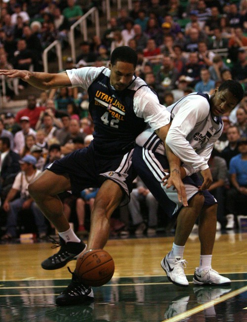 Leah Hogsten | The Salt Lake Tribune
l-r Utah Jazz forward Dwayne Jones II and Trey Burke scramble for a loose ball. Utah Jazz fans filled  EnergySolutions Arena to get a glimpse at this year's players during the annual scrimmage Saturday, October 5, 2013. The Jazz roster currently includes 20 players, but NBA rules require that that number must be reduced to 15 by opening night, Oct. 30 against Oklahoma City.