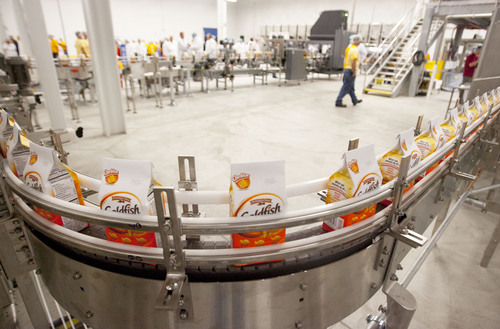 Steve Griffin  |  The Salt Lake Tribune

Employees at the Pepperidge Farm facility in Richmond, Utah, watch the new Goldfish production line operate after the company's ribbon cutting ceremony for the $45 million expansion that has added 94,000 square feet and improved facilities at the 225,000-square-foot site Monday, October 7, 2013. Part of the new area will be used to make the company's Goldfish cracker.