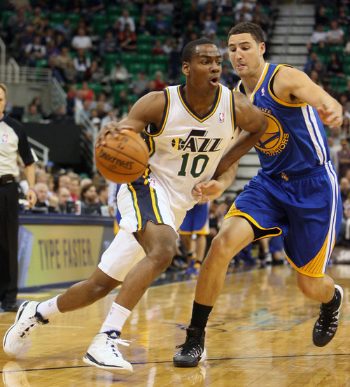 Steve Griffin  |  The Salt Lake Tribune

Utah's Alec Burks  drives past Golden State's Klay Thompson during first half action in the Jazz versus Golden State preseason NBA basketball game at the EnergySolutions Arena in Salt Lake City, Utah Tuesday, October 8, 2013.